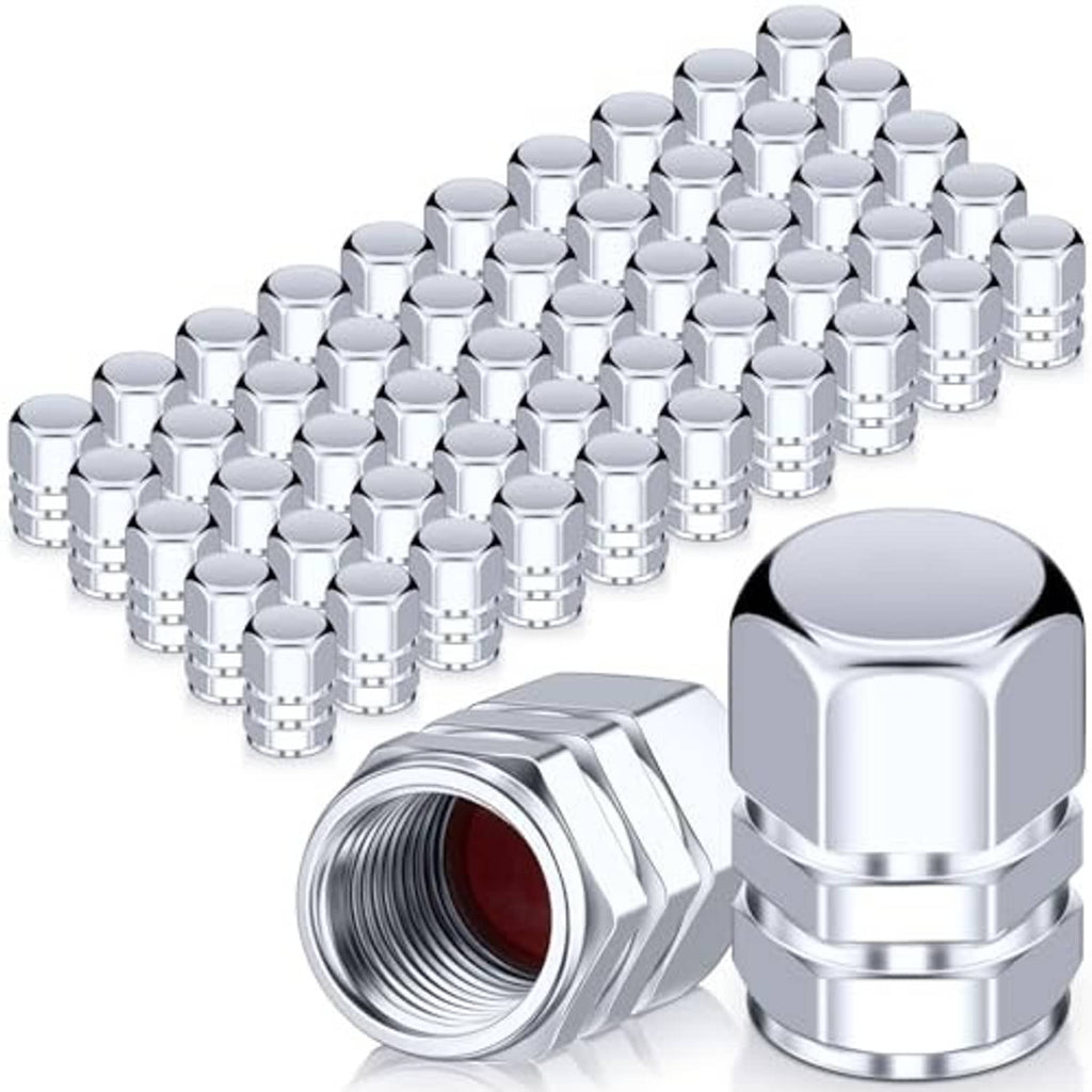 Chrome metal hex tire valve stem caps with threads, close-up single cap plus pile
