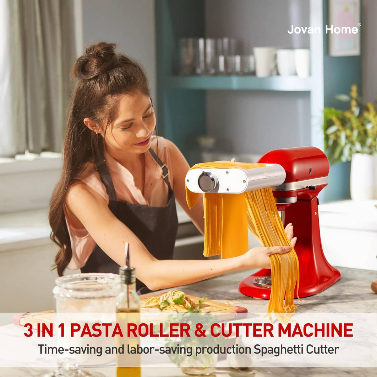 White-and-silver pasta roller attachment cutting yellow spaghetti strands on red stand