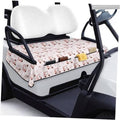 Pink patterned golf cart seat cover with repeating cart icons on the bench