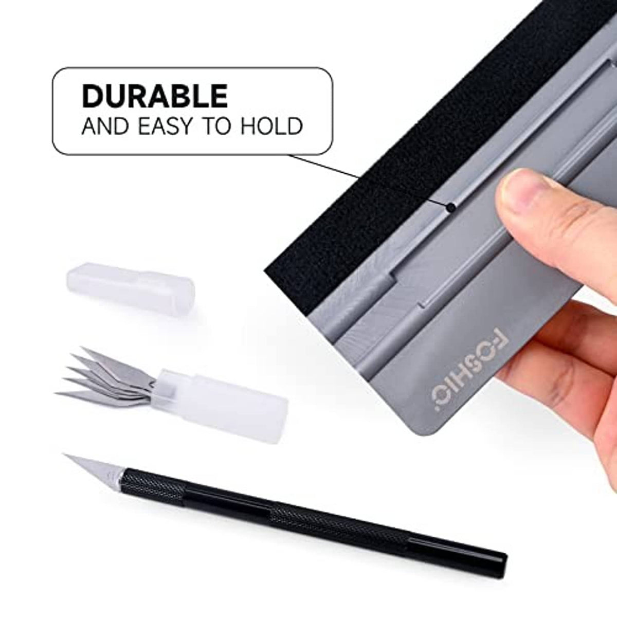 Window tint squeegee felt pad with black craft knife; hand holds the squeegee