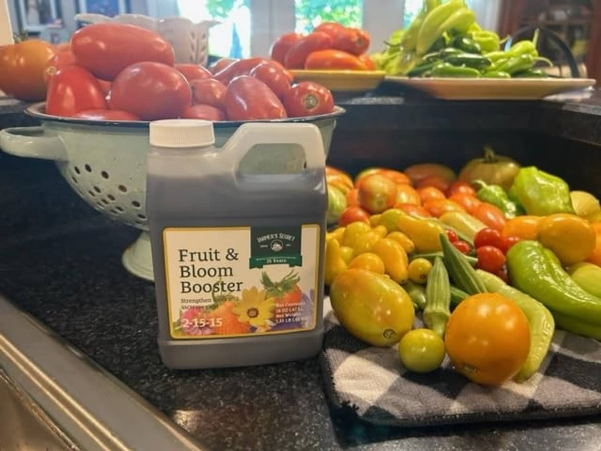 Fertilizer canister on countertop with fresh vegetables and tomatoes