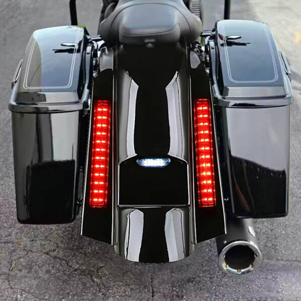 Rear fender with vertical red LED light bars and chrome trim, black glossy housing.