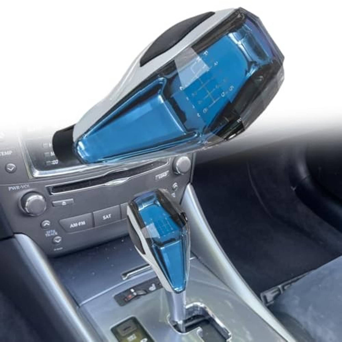 Illuminated touch gear shift knob installed in car center console, blue lit panel visible