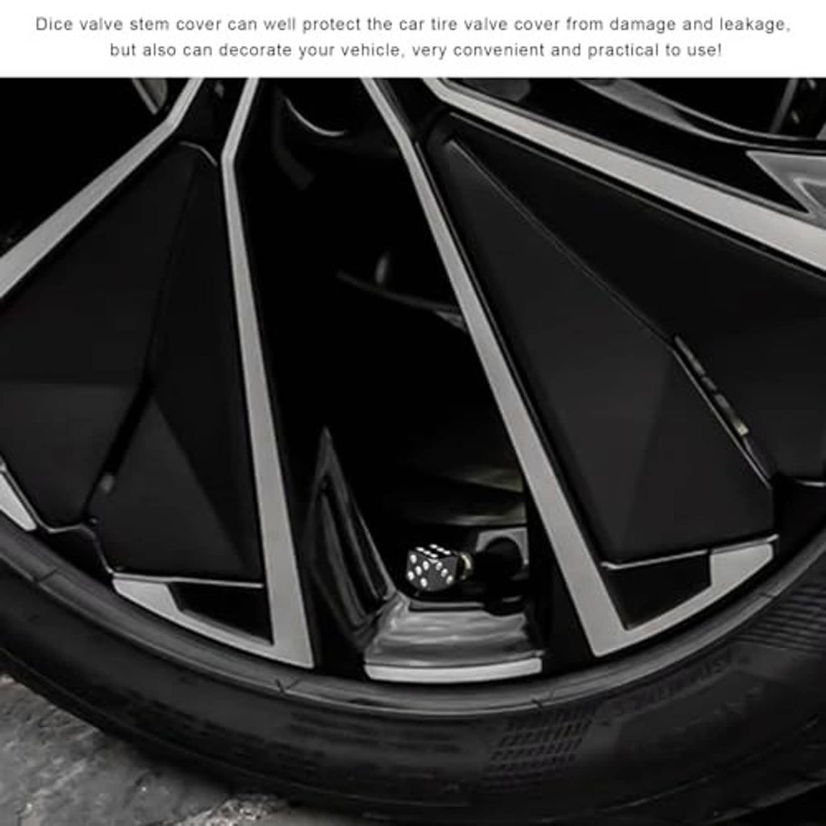 Black dice valve stem cap with silver dot pattern installed on a tire valve