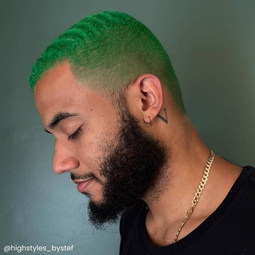 Iris green hair dye result on short hair with shaved sides and green top