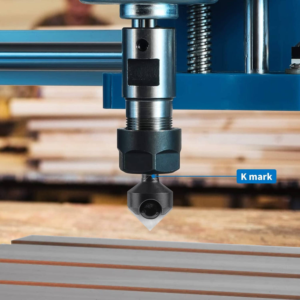 V-groove router bit mounted in a router, cutting on a wooden board