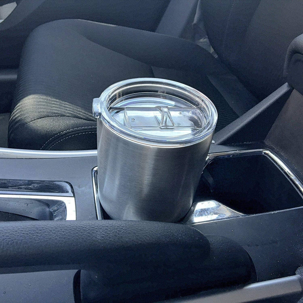Stainless tumbler with clear replacement lid and straw opening