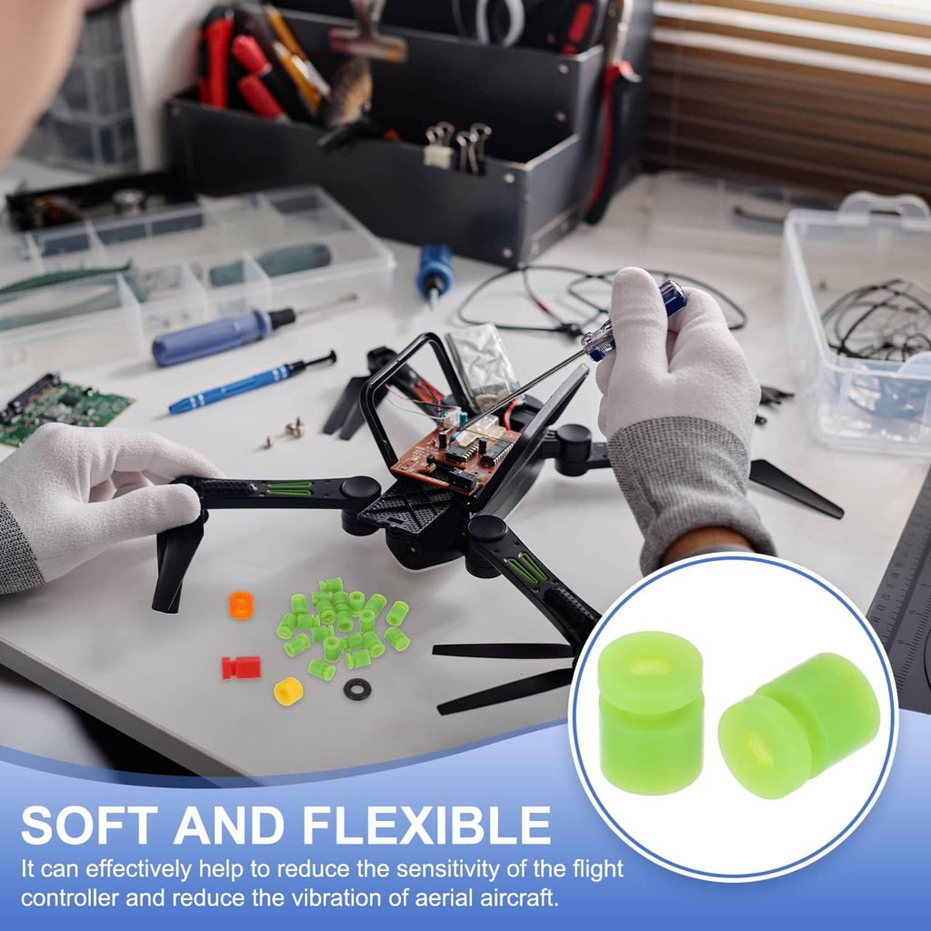 Green rubber RC damping balls on workbench, small cylindrical pieces with central holes.