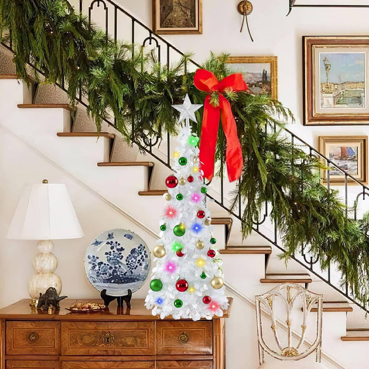 White pop-up Christmas tree with multicolor LED lights and red, green, gold bauble ornaments