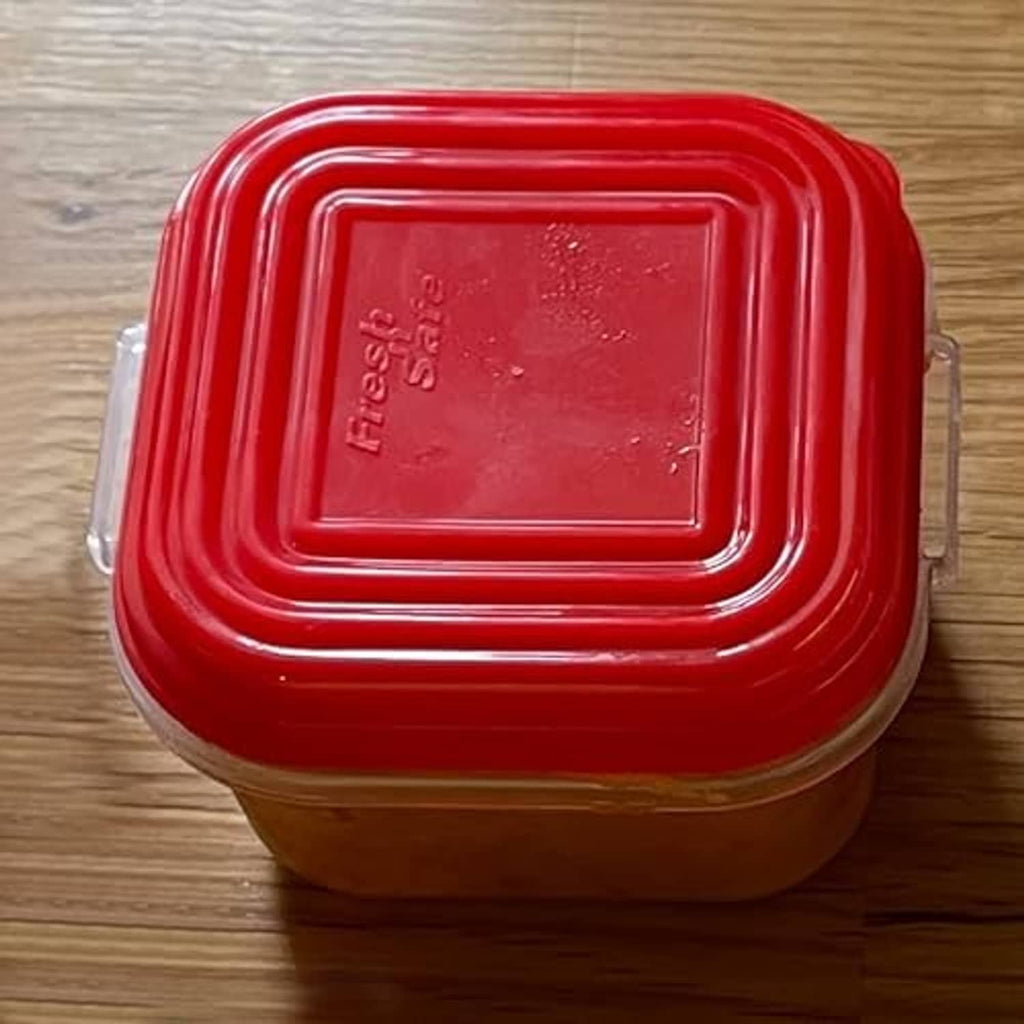 Single baby food container with red snap lid and clear base