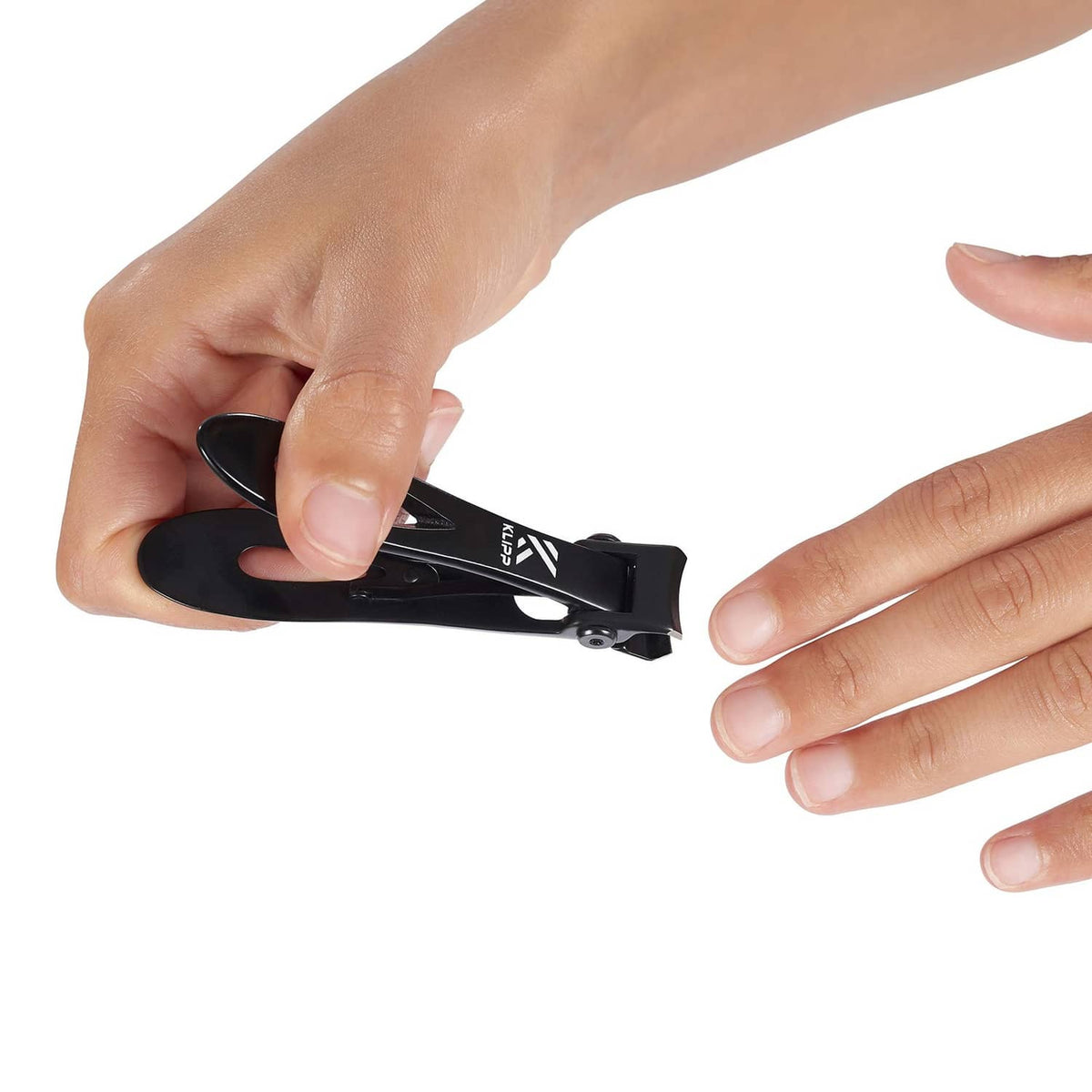 Black toenail clippers in hand, wide opening and thumb lever