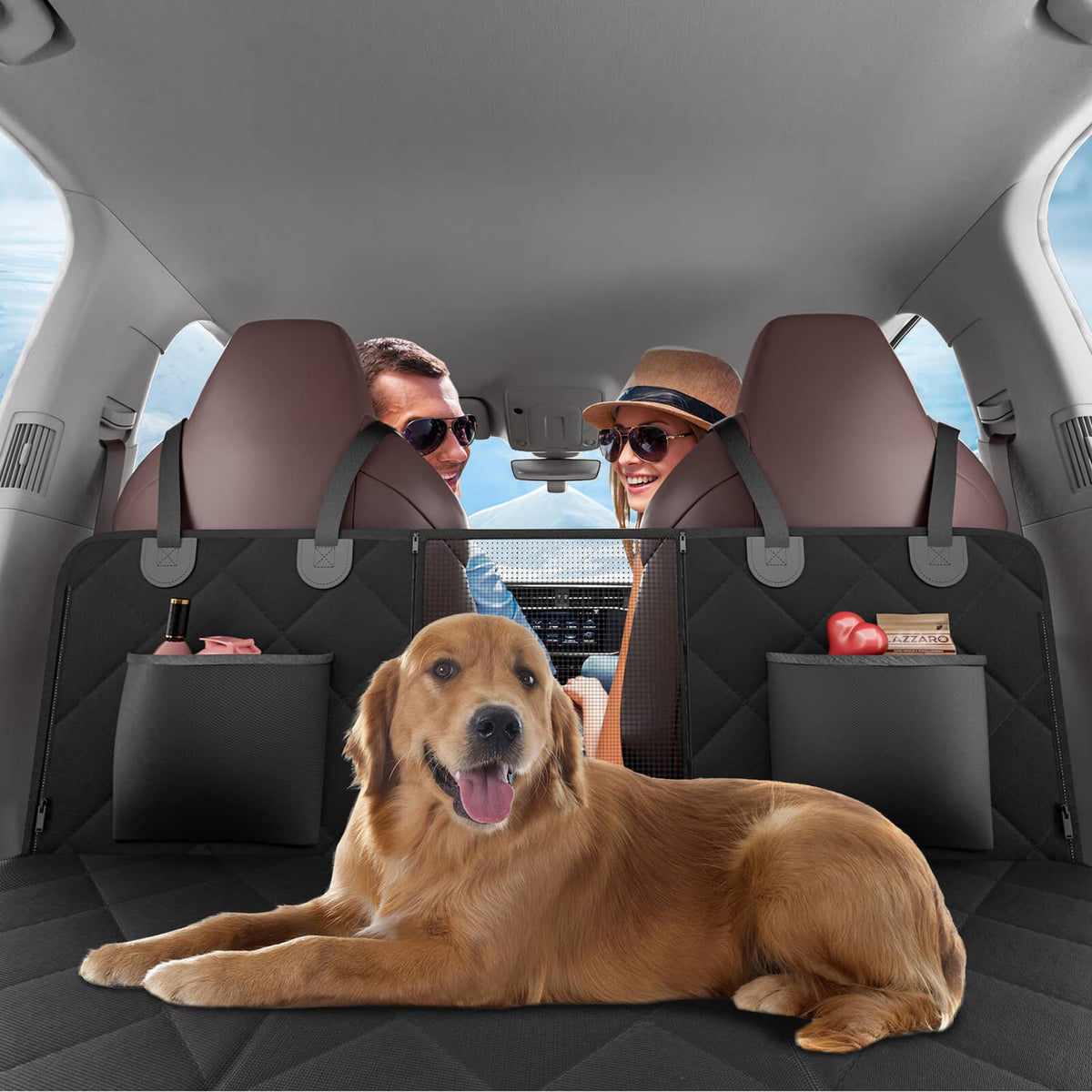 Dog lying on black back seat cover with side storage pockets and mesh panel