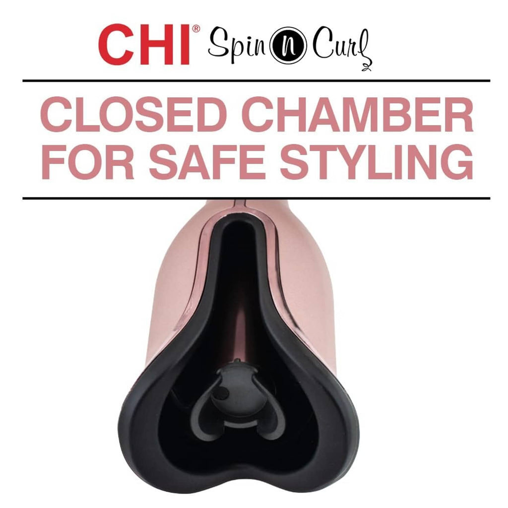 Rose gold rotating curling iron with closed U-shaped chamber and black inner barrel