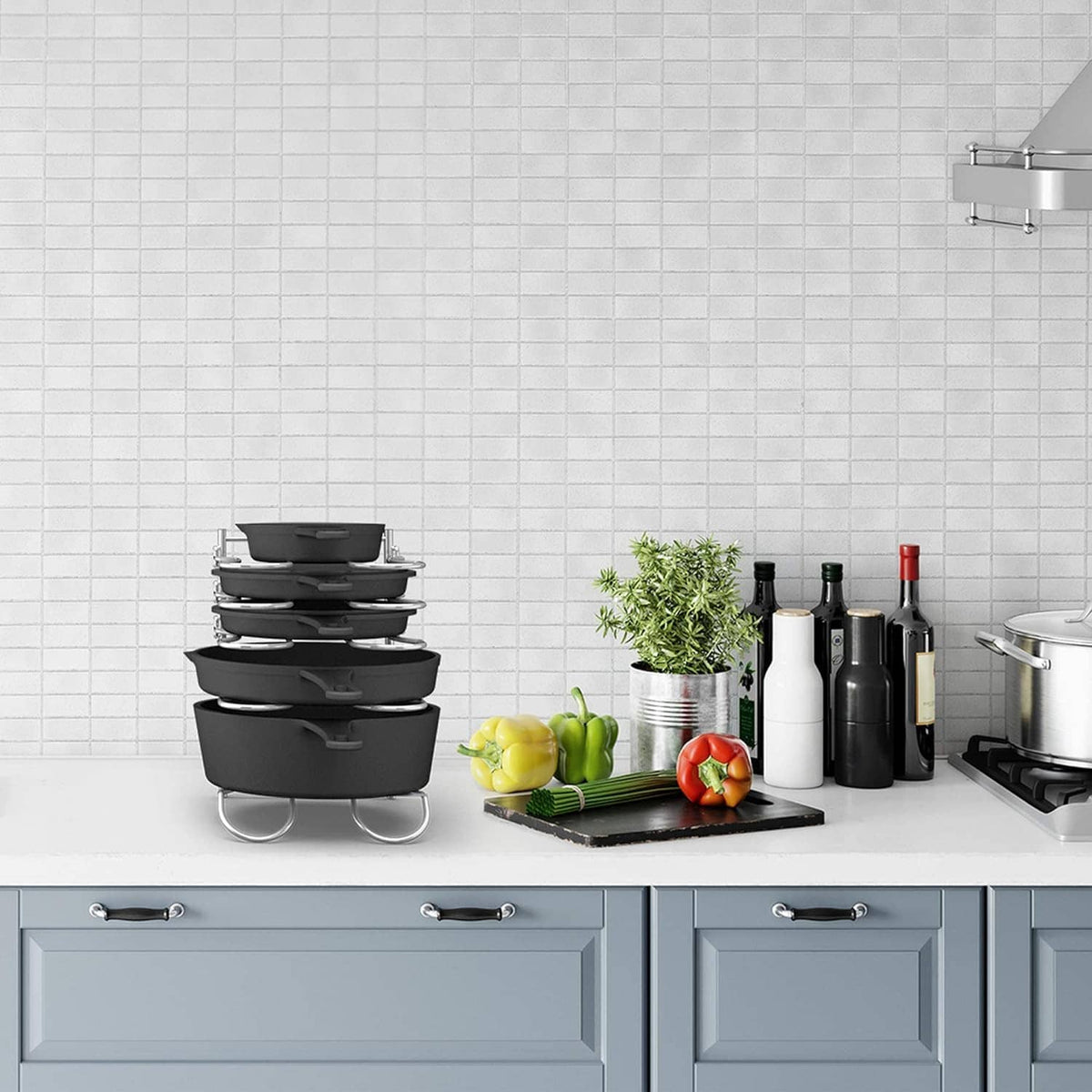 Countertop pot and pan rack organizer holding several black pans and lids