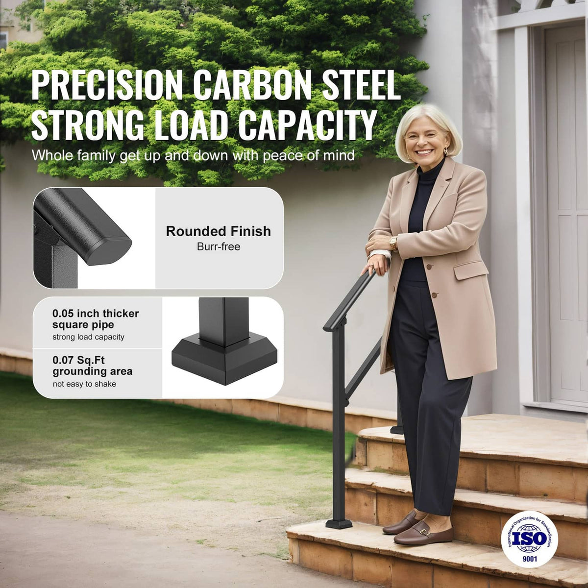 Black carbon-steel stair handrail on outdoor steps, rounded top rail
