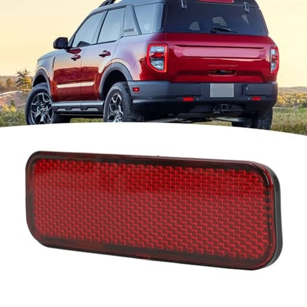 Red rectangular rear bumper reflector with textured lens and dark edging, front-angled