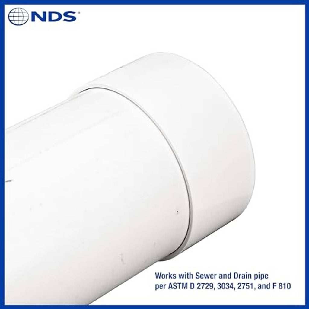 White 6-inch PVC S&D end cap fitted on pipe stub, close-up angle