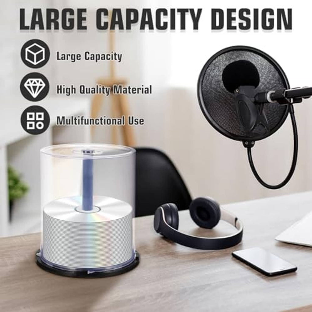 Clear CD/DVD spindle storage case with central hub and dark base ring on desk