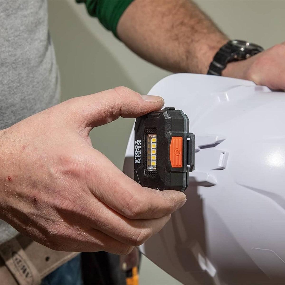 Hand installing battery module into a rechargeable LED headlamp