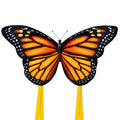 Monarch butterfly kite with orange-and-black wings and two yellow streaming tails