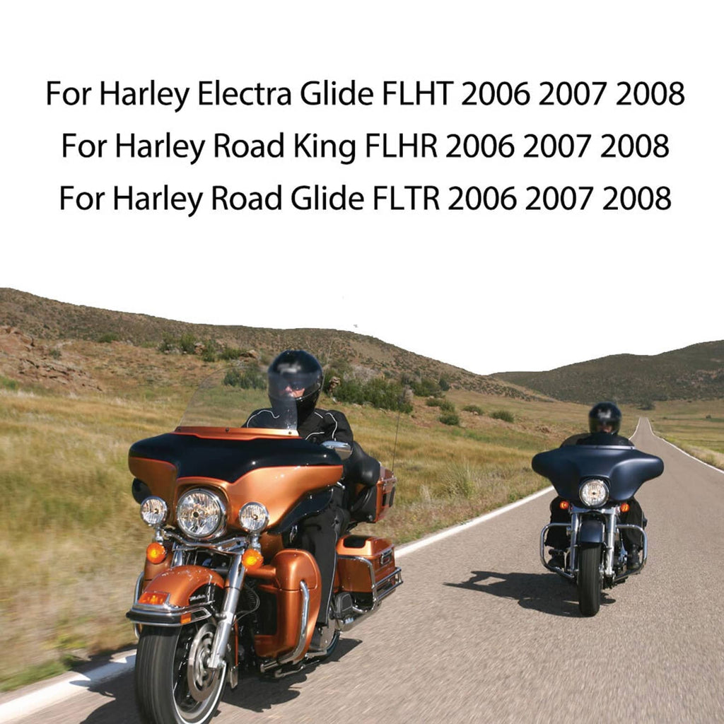 Two Harley touring motorcycles riding on a road under open sky