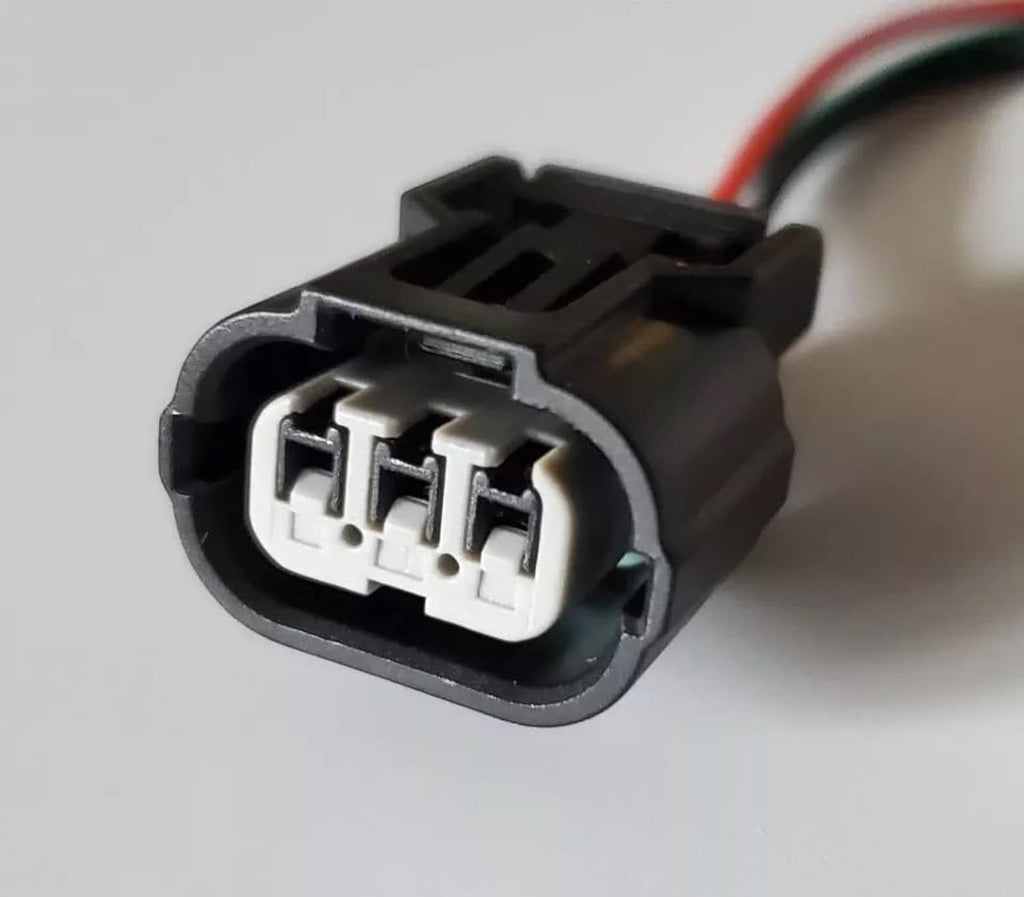 3-way female connector plug, close-up of triple-pin socket in black housing