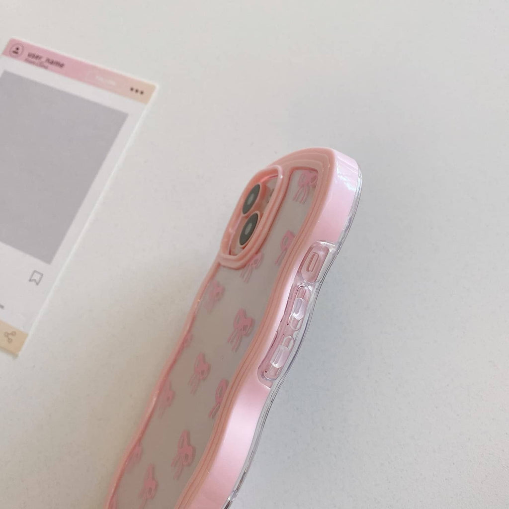 Pink clear iPhone case side view with bow pattern and port/button cutouts.