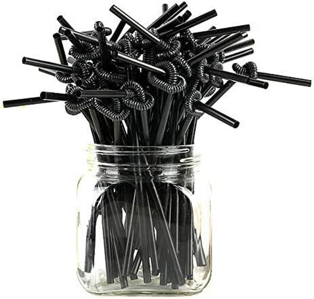 Extra-long black drinking straws in a clear jar with curly spring tips