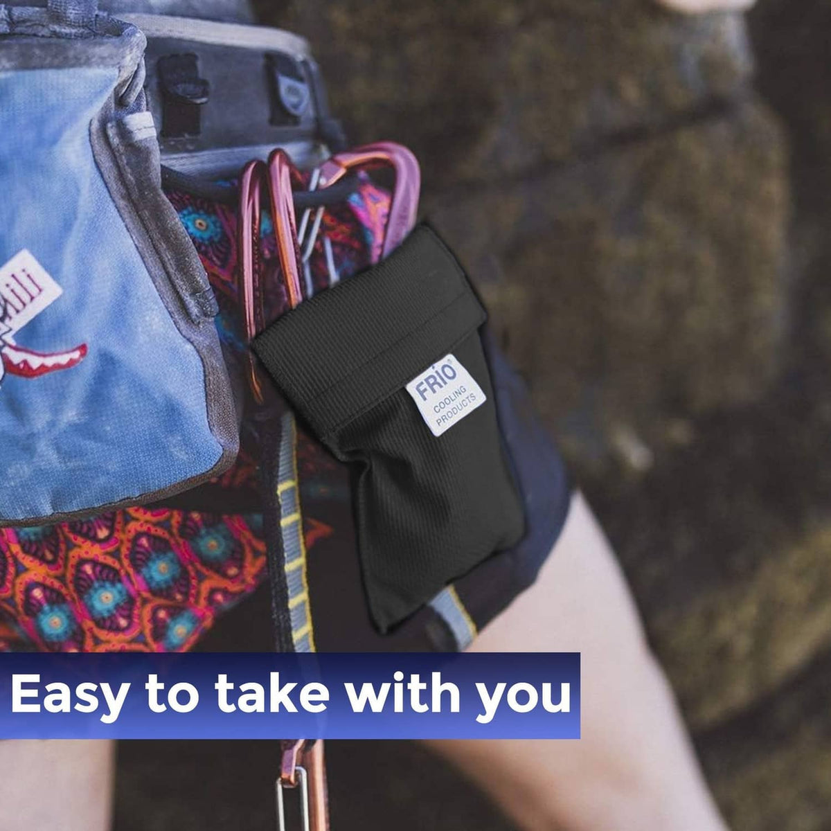 FRIO mini cooling wallet, black pouch clipped to a bag pocket