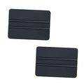 Set of black vinyl squeegees with ribbed plastic edges, rectangular scraper tool.