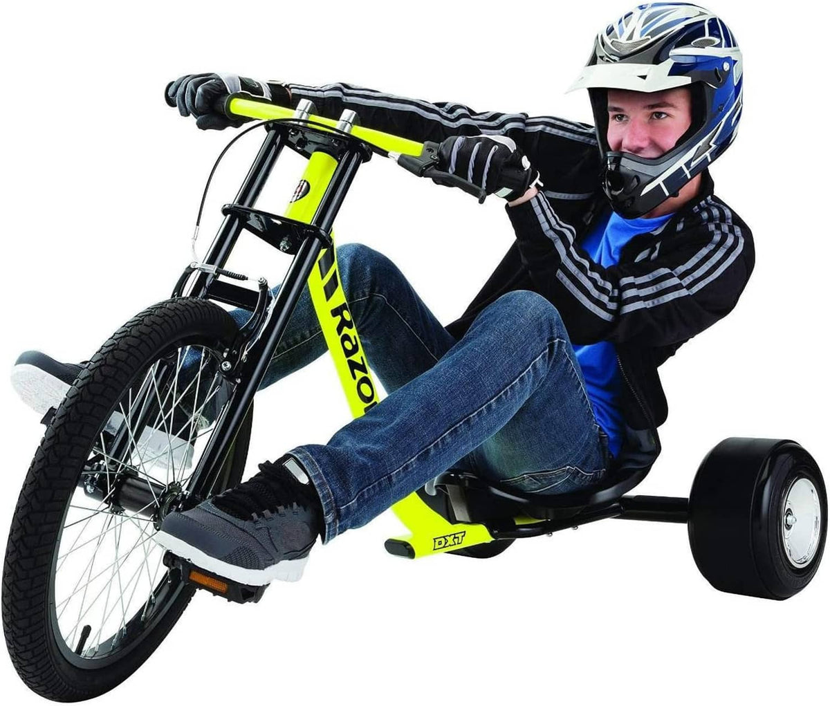 Neon yellow drift trike with black seat; rider wearing helmet and gloves