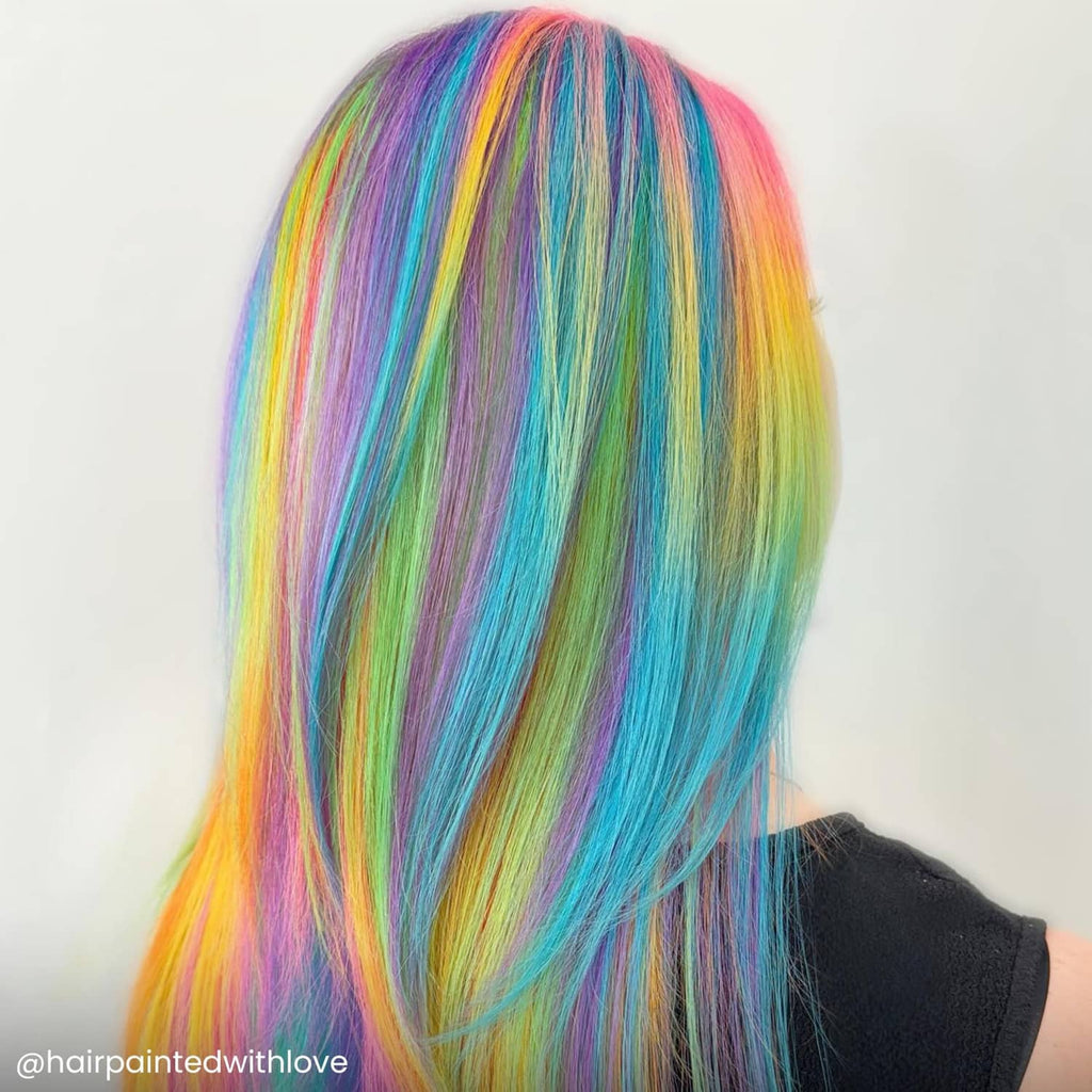 Diluter usage on hair: straight pastel rainbow hair, side view with blue and rainbow streaks