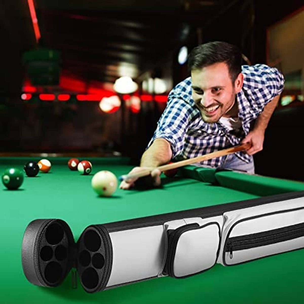 Hard oval pool cue carrying case on a billiard table with cue held near the case