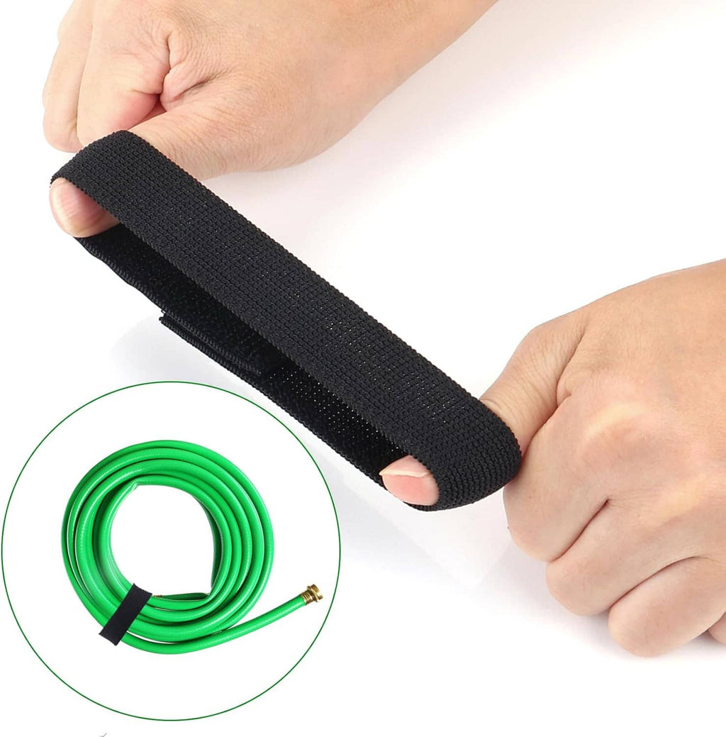 Hands holding a black boot blousing strap band with hook-and-loop closure