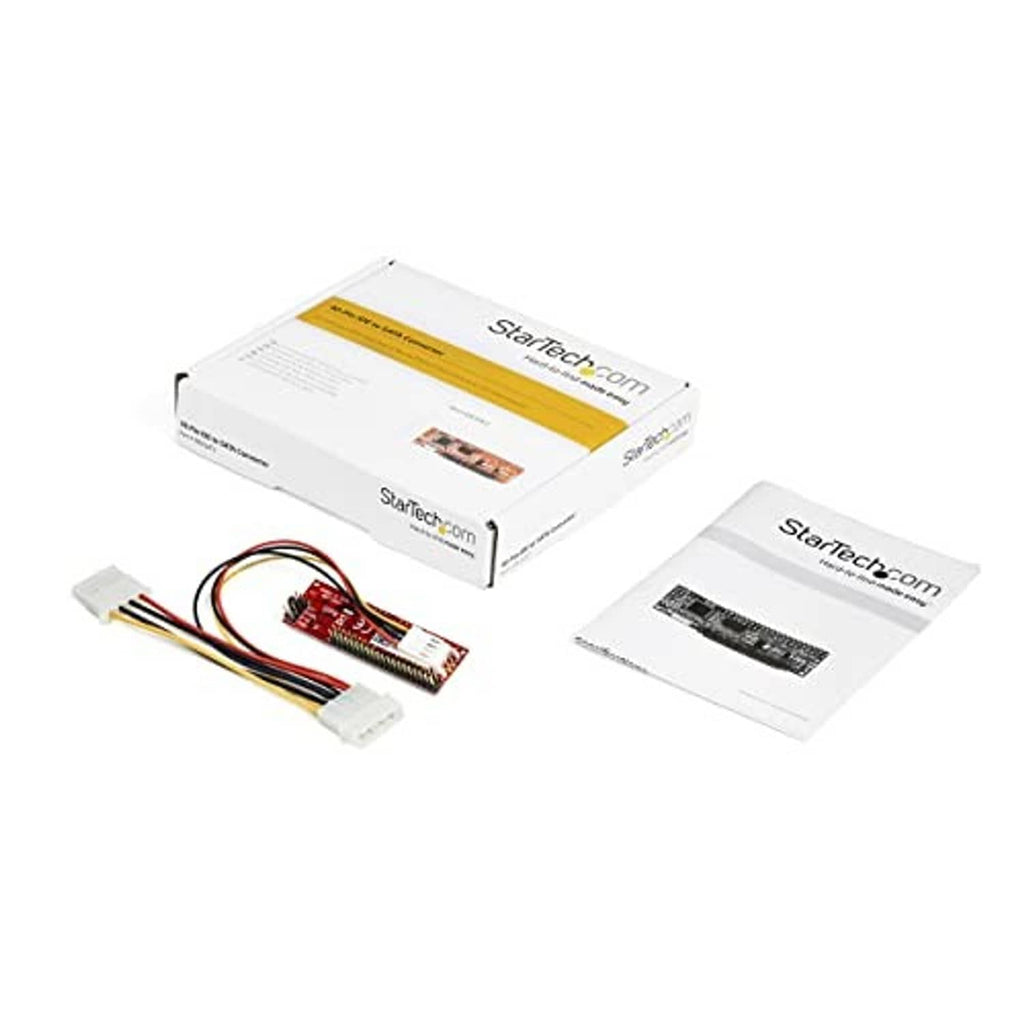 PATA-to-SATA adapter kit with boxed packaging, circuit board, cables, and manuals