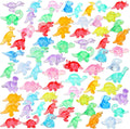 Assorted mini resin dinosaur figures, multicolored and scattered on a white surface
