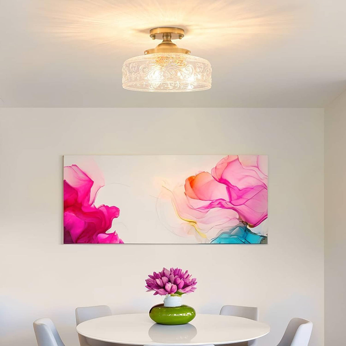 Semi-flush ceiling light with gold base and clear embossed globe glass shade