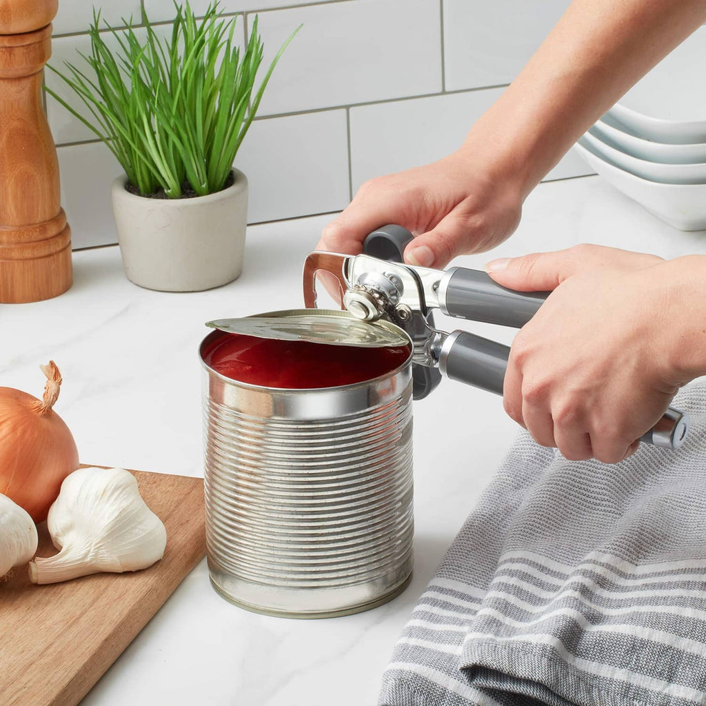 KitchenAid can and bottle opener cutting lid on a metal can with charcoal handles