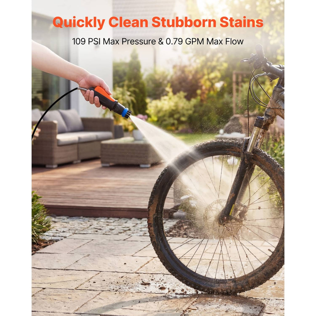 Portable cordless pressure washer producing a spray stream from an orange/gray unit