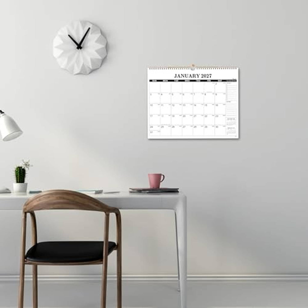 January 2027 wall calendar mounted on wall with spiral binding