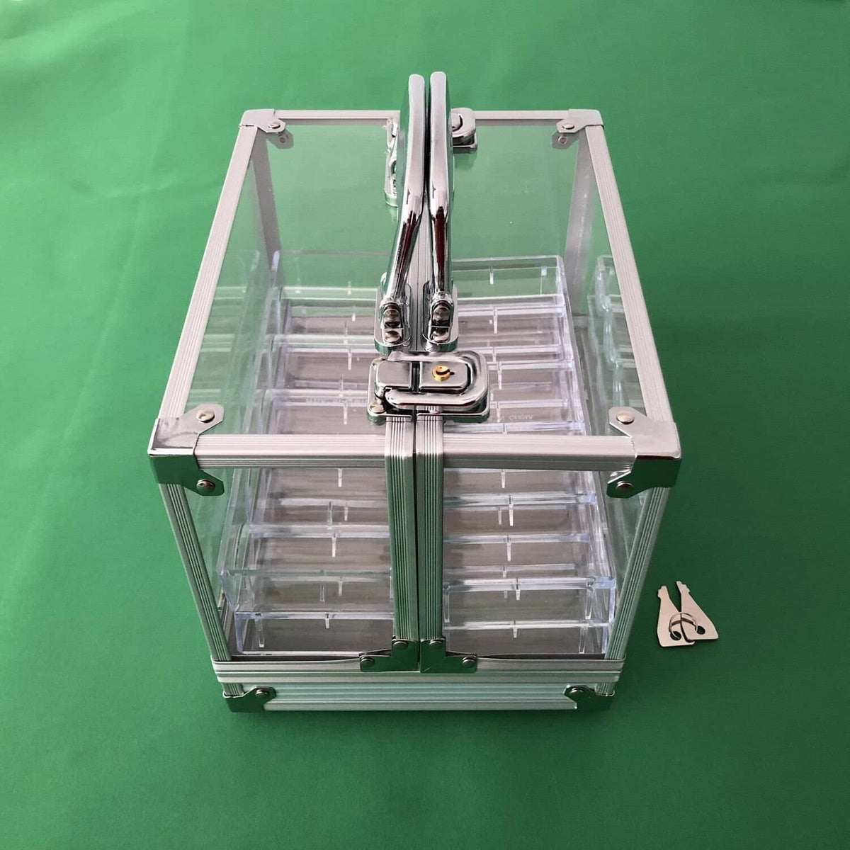 Clear acrylic poker chip carrier with front latch and visible internal divider grid
