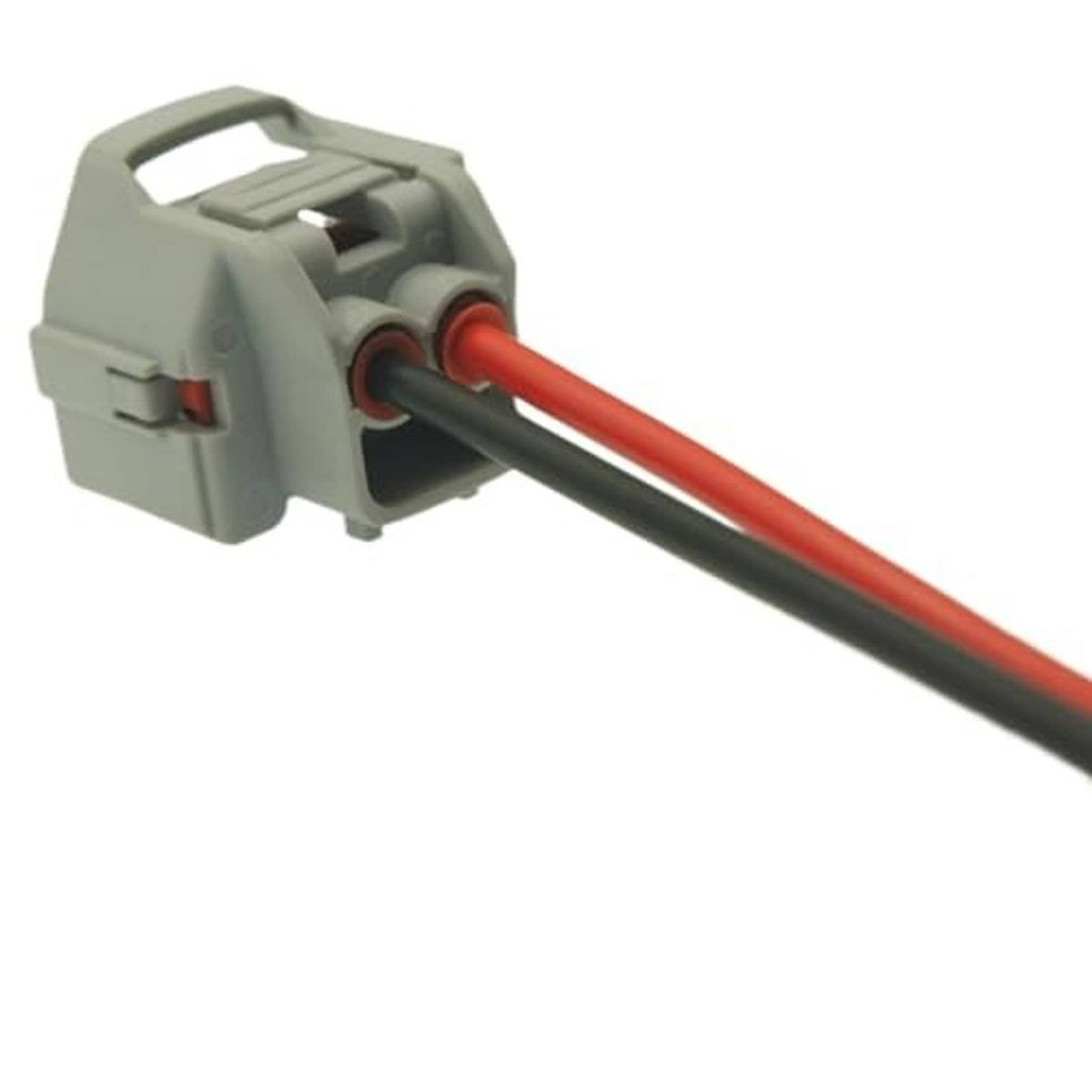 Gray AC compressor connector housing with red and black wires extending outward