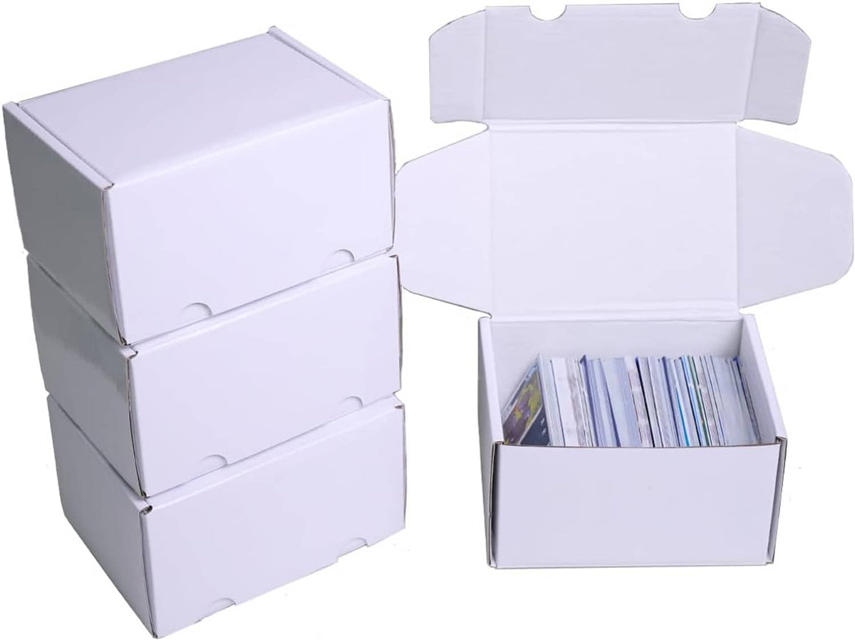 White cardboard card storage boxes, stacked and open with trading cards inside