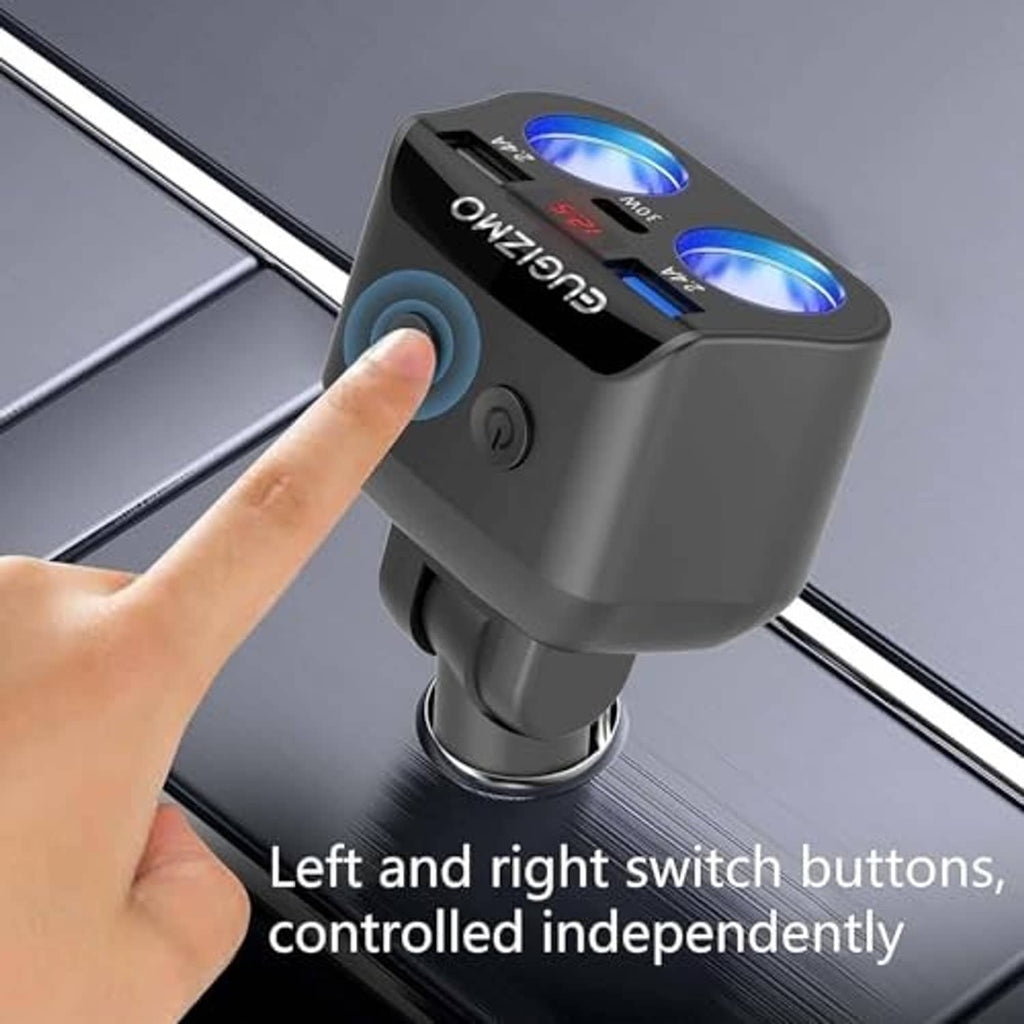 Hand pressing button on car charger adapter, black body with two blue LED rings and 12.5 screen