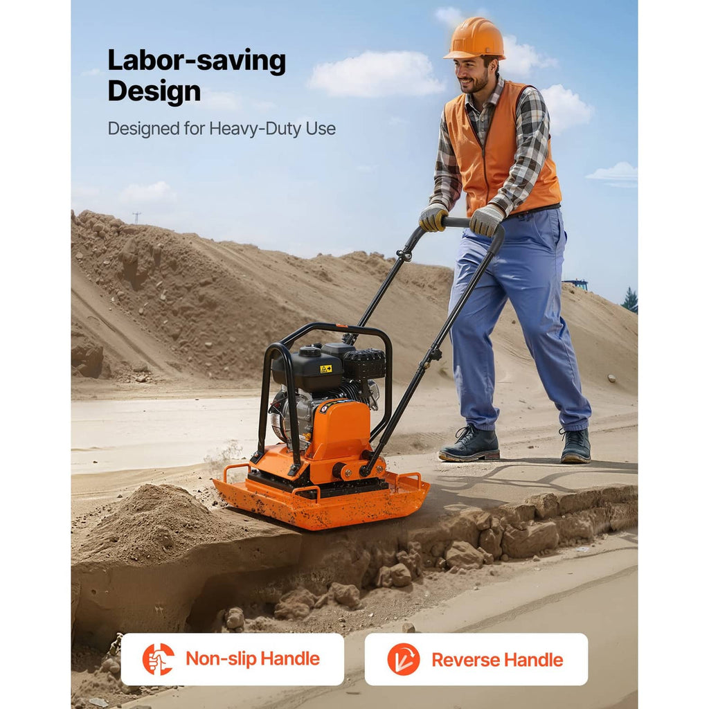 Orange and black plate compactor held by operator on construction surface