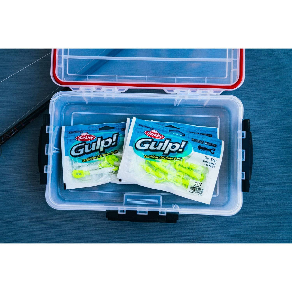 Berkley Gulp soft bait shrimp packages in a clear tackle box