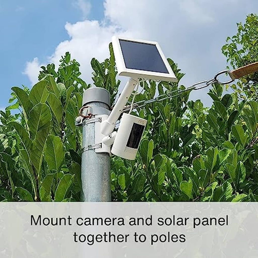 White camera and solar panel mount attached to a round outdoor metal pole