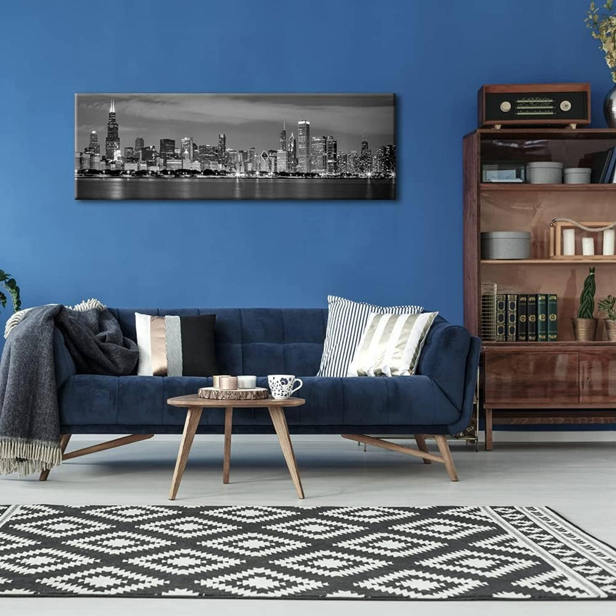 Black and white city skyline canvas print mounted on a blue wall