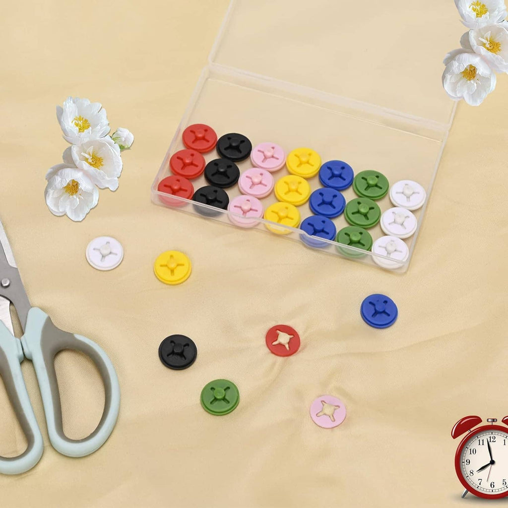 Running bib clips laid out with clear storage box, multicolor star-headed clips