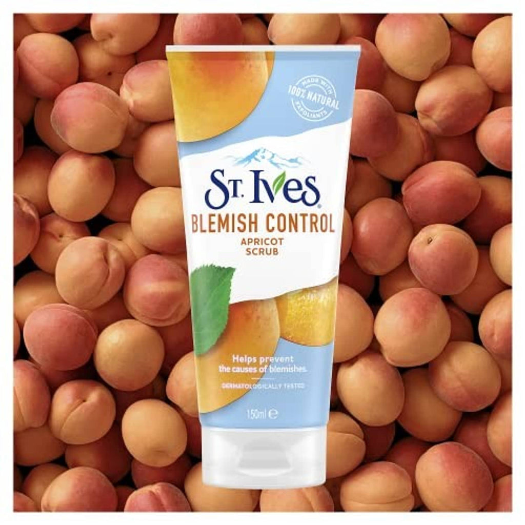 Apricot facial scrub tube standing among apricots